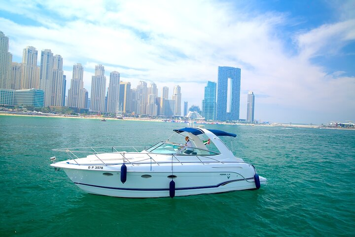 Experience the stunning Dubai skyline from the comfort of your private yacht while exploring iconic landmarks and enjoying serene moments on the water with friends and family.